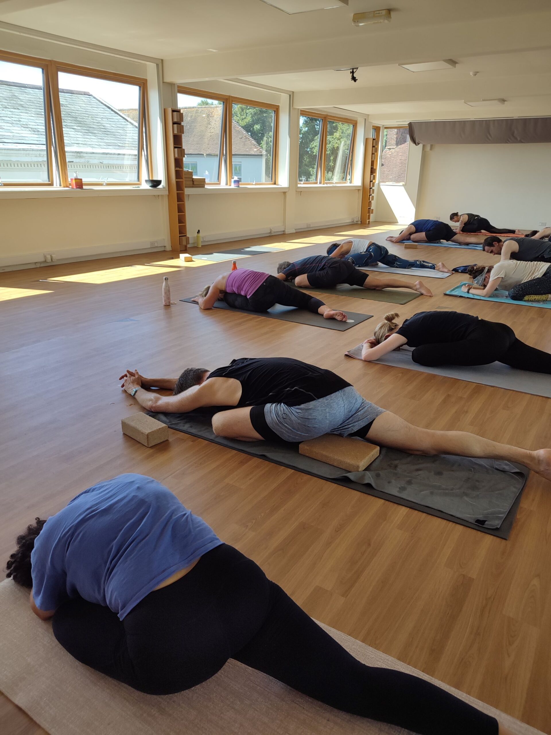 Students practising hot yoga in a heated studio.